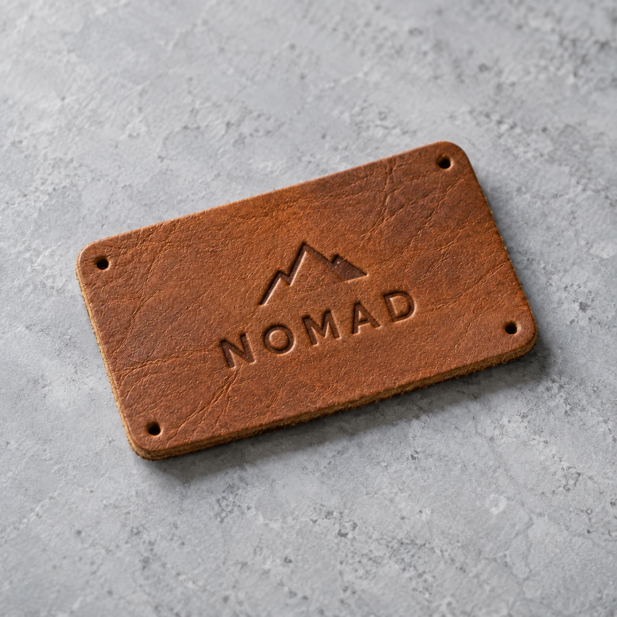 Debossed genuine leather patch with natural grain