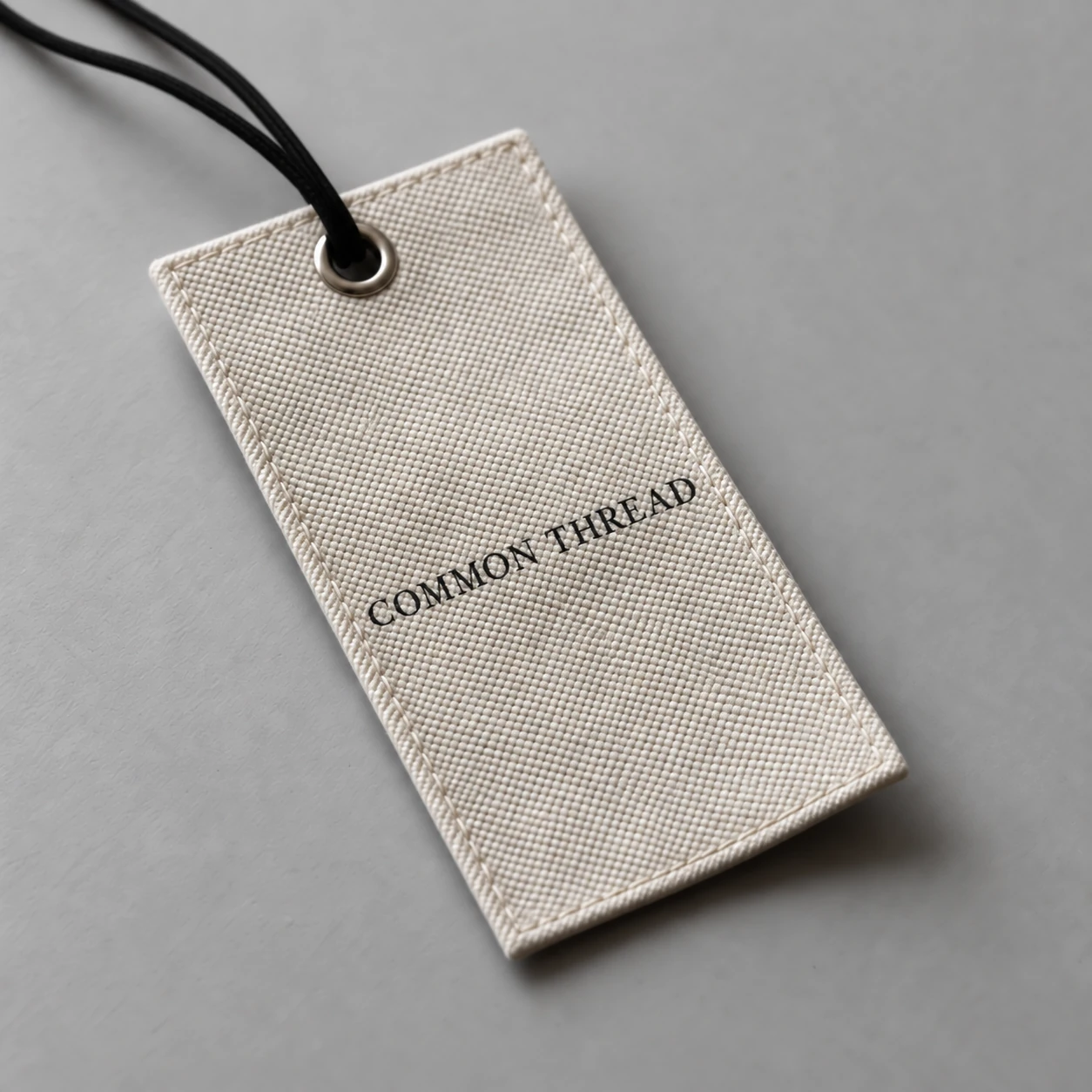 Fabric hangtag with a hole and hanging cord