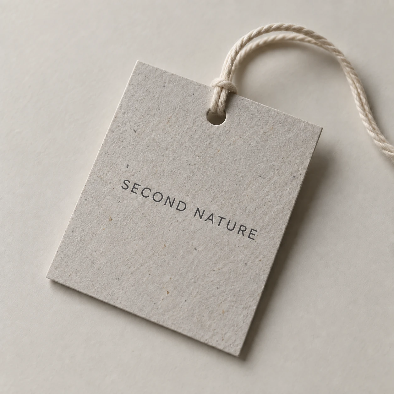 Uncoated recycled paper hangtags with visible flecks